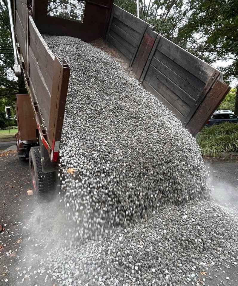 Limestone gravel being dumped from delivery truck