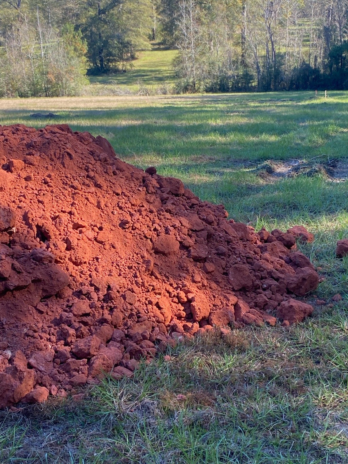 Red clay dirt pile delivered to job site