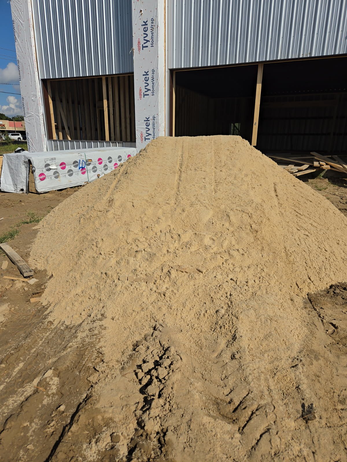 Sand pile delivered to warehouse build
